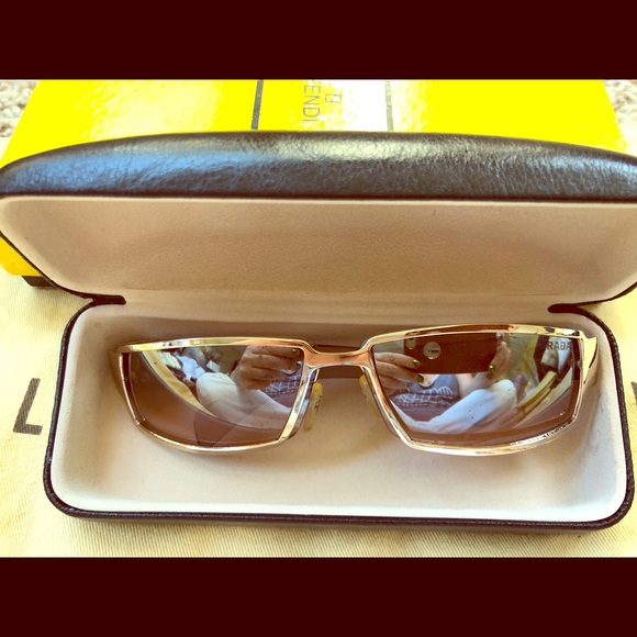 Prada Gold Preowned glasses .Minor scratches. - Picture 1 of 4